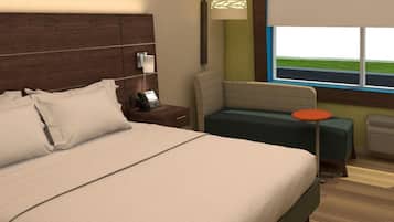 Una habitació d'hotel amb un llit gran, una taula de nit amb un telèfon, una taula rodona petita, una cadira i una finestra amb vistes a l'exterior.