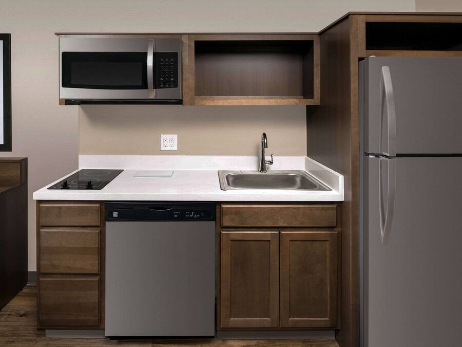 Full-size fridge, microwave, stovetop, cookware/dishes/utensils