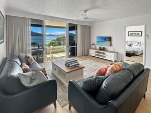 2 Bedroom Apartment Hibiscus 104 | Living area | Flat-screen TV, DVD player - Beach Lodges (Whitsundays)