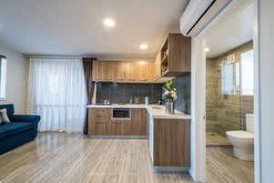 Apartment, 2 Bedrooms | Private kitchen | Fridge, microwave, stovetop, coffee/tea maker