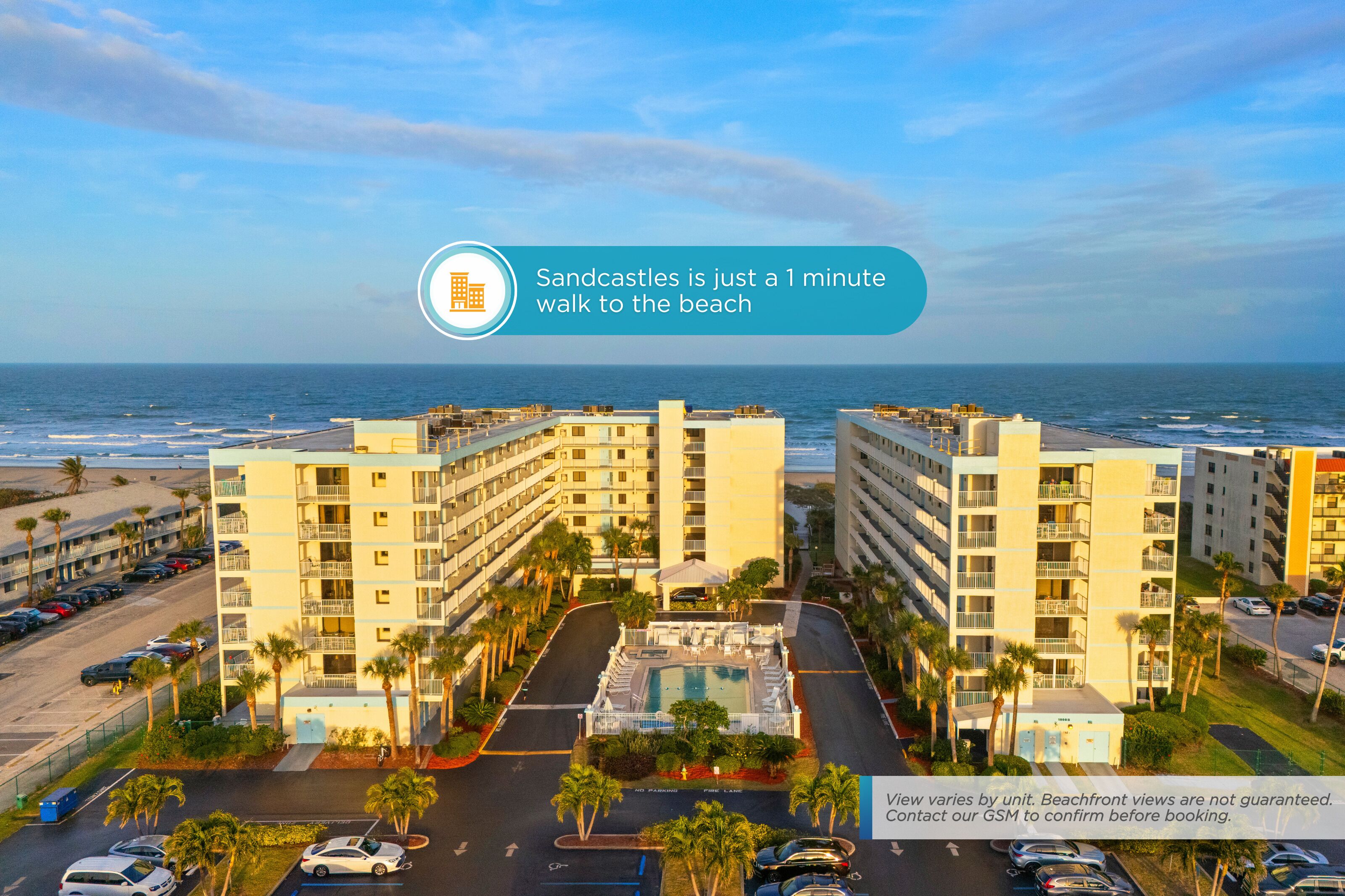 A multi-story hotel with a pool and a view of the ocean.