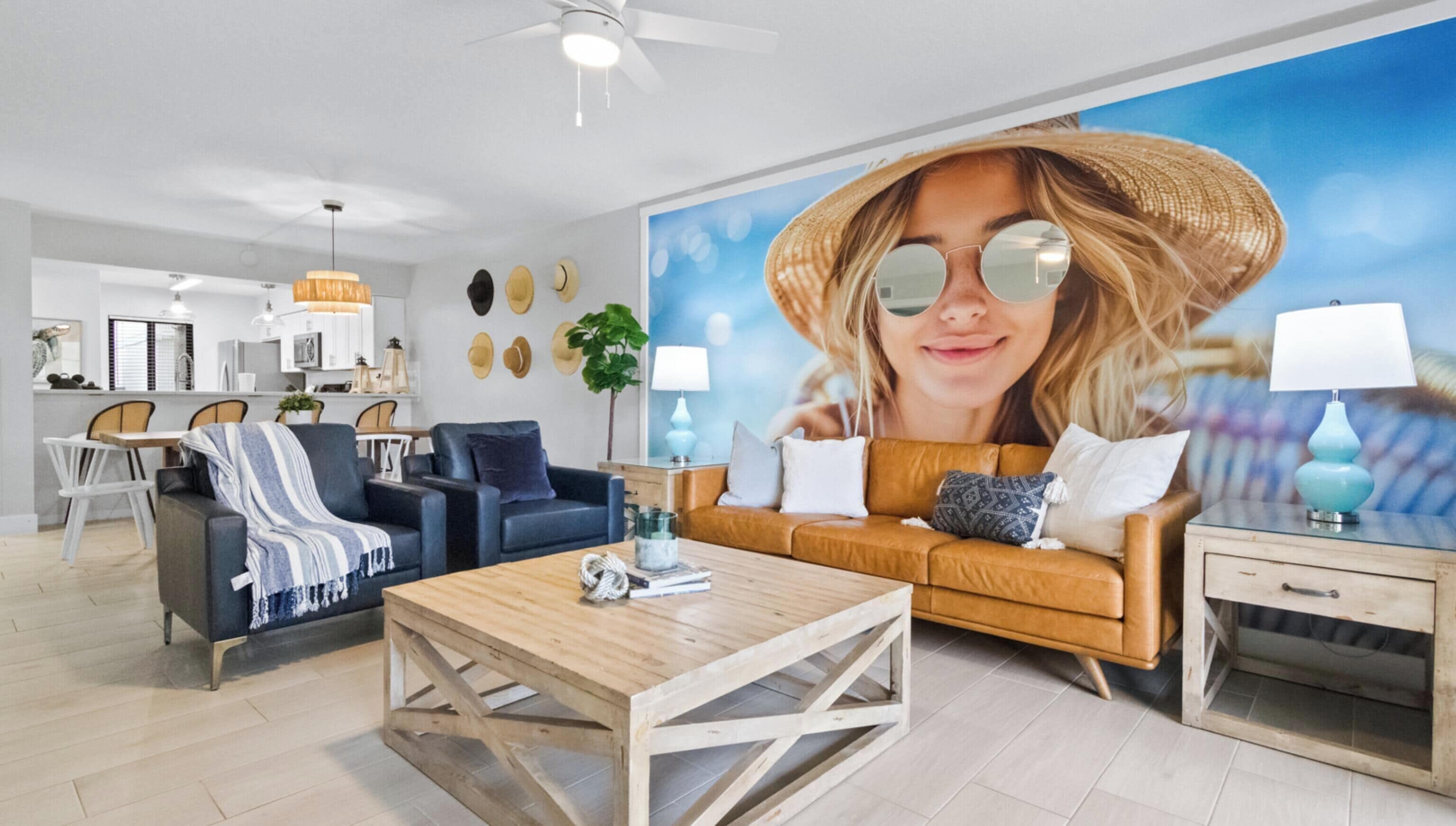 A modern living room with a large sofa, a coffee table, and a dining area with chairs.