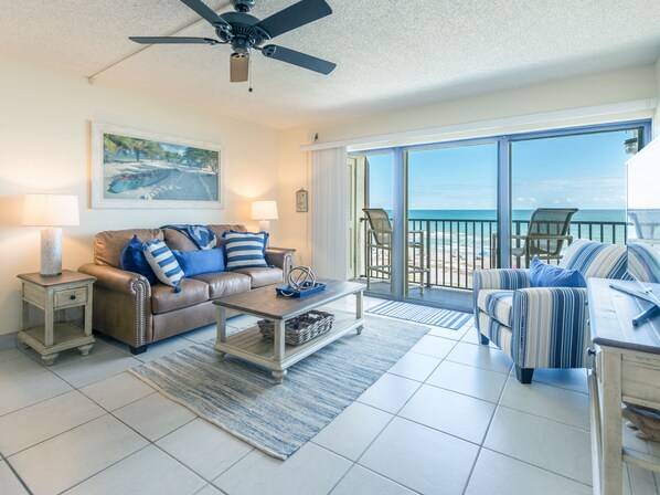 Penthouse, 2 Bedrooms, Oceanfront | Living room | Flat-screen TV - Chateau by the Sea - Happy Palm Stays (Cocoa Beach)