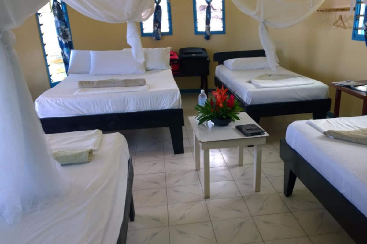 Family Beachfront Oceanview Fale | Iron/ironing board, bed sheets
