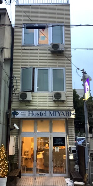 A two-story building with a sign for "Osaka Namba Hostel MIYABI". - Osaka Namba Hostel MIYABI (Osaka)
