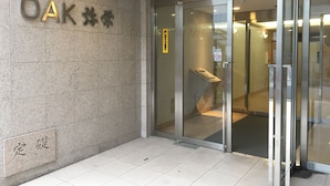 A building entrance with a sign reading "OAK" and a no-smoking sign. - The Wonder At Stay -bentencho- (Osaka)