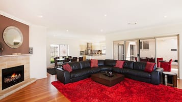 4-Bedroom, 4-Bathroom House | Living area | Flat-screen TV, fireplace, DVD player, MP3 dock