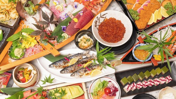 A variety of sushi and sashimi dishes, including fish, shrimp, and caviar, arranged on a table. - Livemax Resort Hakone Ashinoko (Hakone)