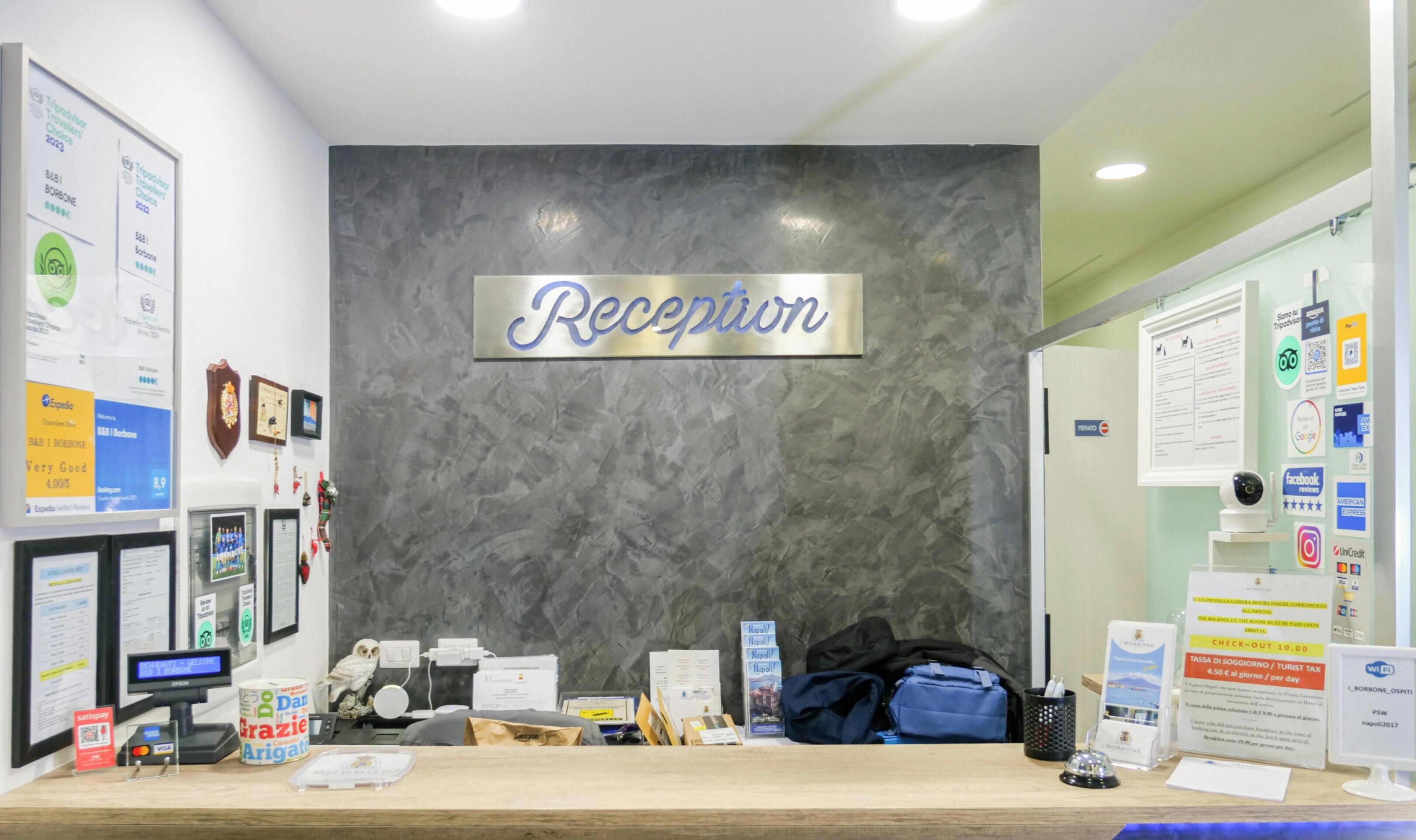 A reception desk with a sign that reads 'Reception' above it.