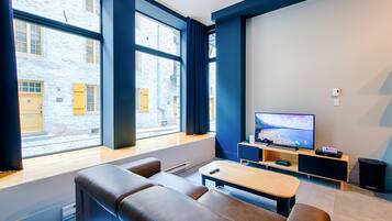 Luxury Apartment, 1 Bedroom with Sofa bed (Accessible by stairs only) | Living room | 36-inch flat-screen TV with cable channels, TV