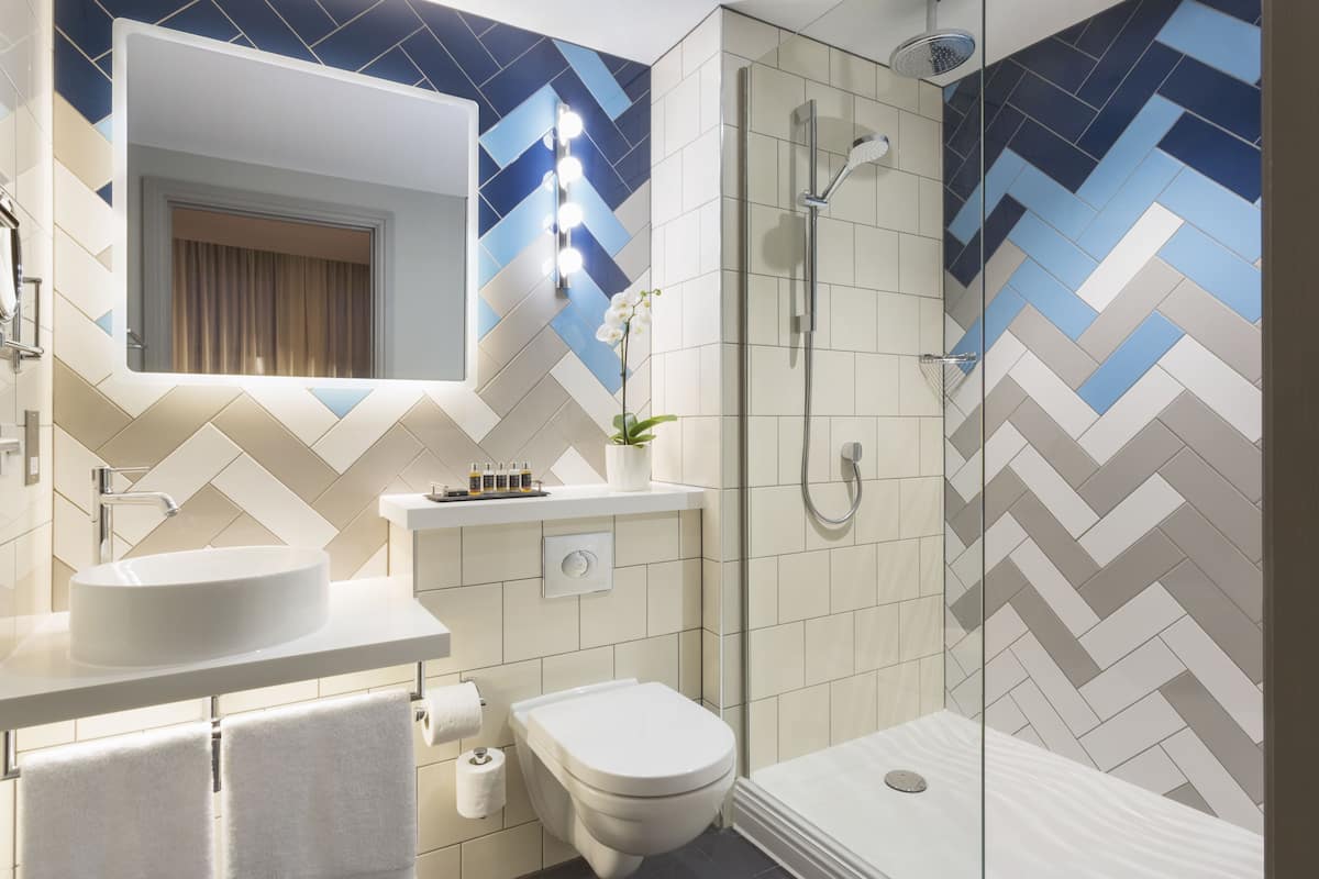 premium room, 1 queen bed | bathroom | shower, designer toiletries, hair dryer, bathrobes