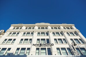 A hotel building with a classical architectural style, featuring a prominent sign reading 'hotel INDIGO'. - Hotel Indigo Cardiff by IHG (Cardiff)