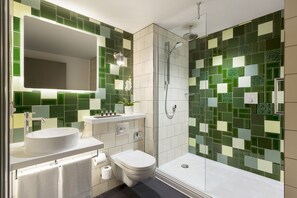 Shower, designer toiletries, hair dryer, bathrobes