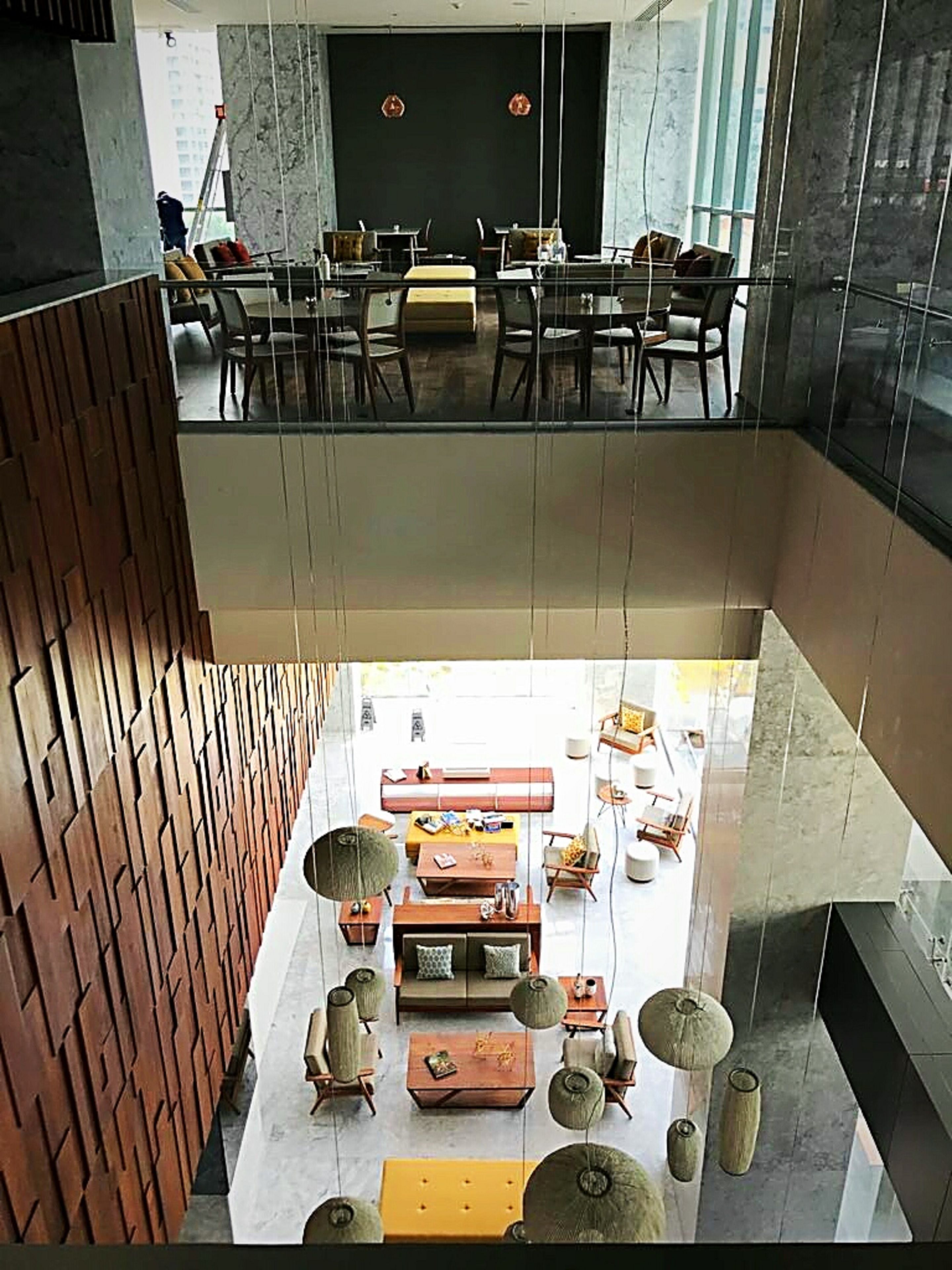 A modern interior with a dining area and a lounge space.