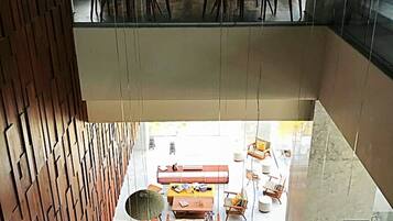 A modern interior with a dining area and a lounge space.