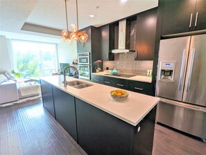 Premium Townhome, 2 Bedrooms, Non Smoking, City View | Private kitchen | Full-size fridge, microwave, oven, stovetop