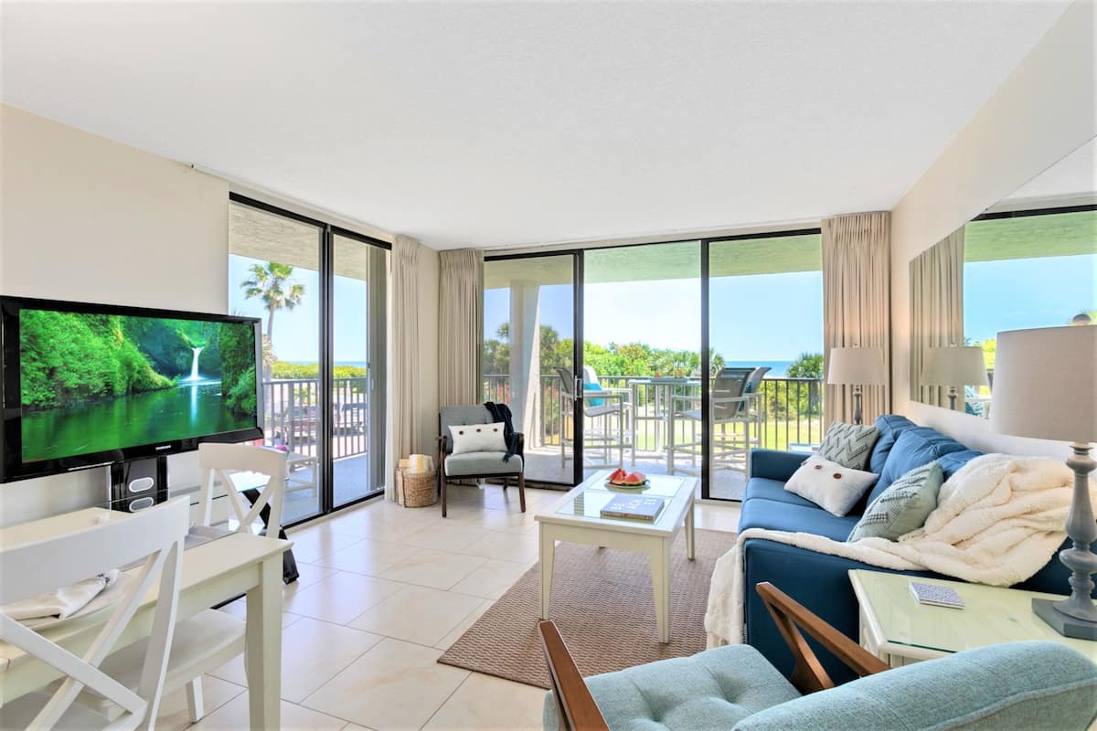 Standard Condo, 2 Bedrooms, Oceanfront | Living room | Flat-screen TV
