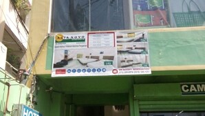 A hotel entrance with a sign indicating room rates and a reception desk. - Asia Novo Boutique Hotel - Alaminos (Alaminos)
