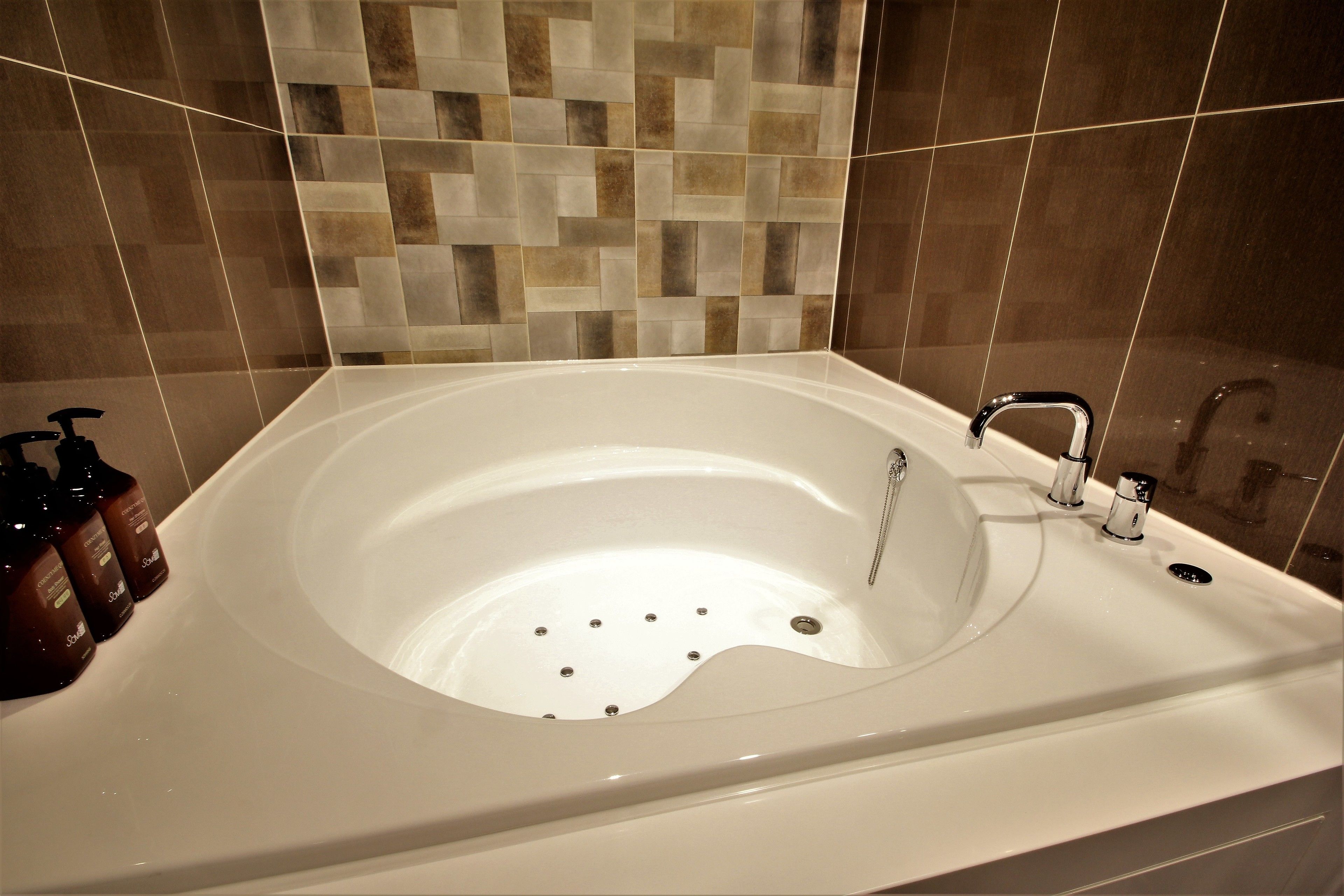 twin room | bathroom | separate bathtub and shower, designer toiletries, dressing gowns