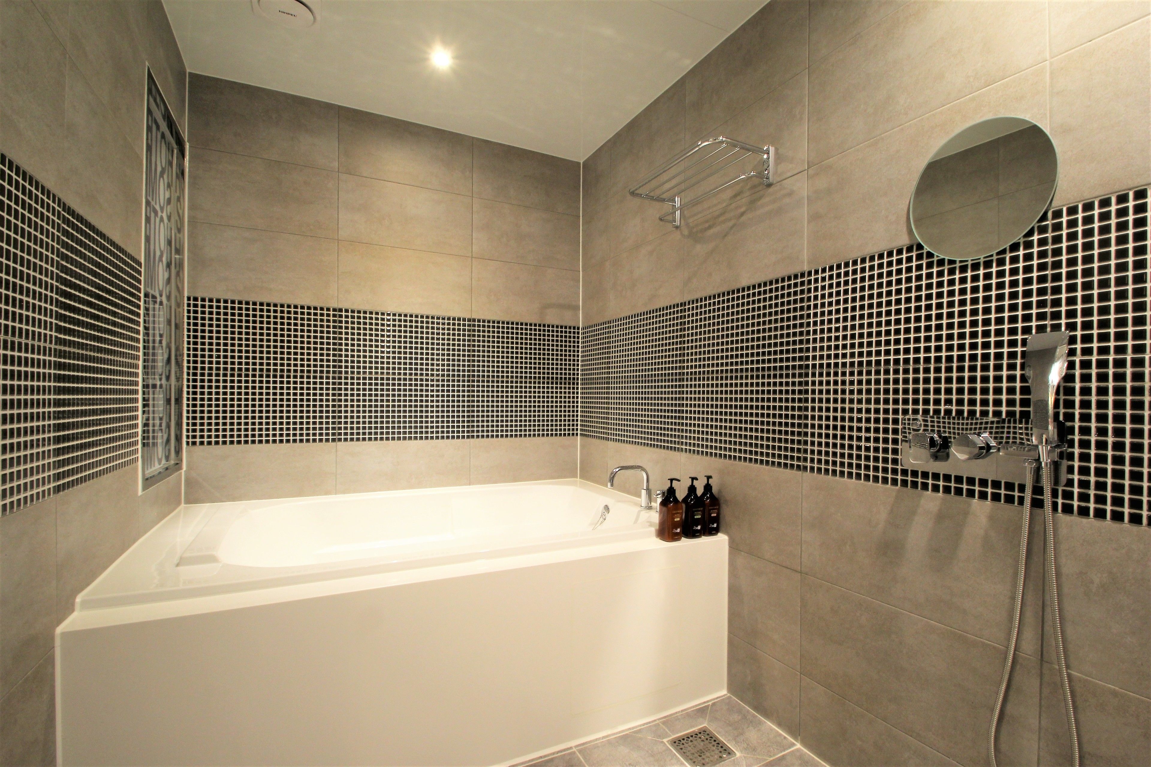 premium room | bathroom | separate bathtub and shower, designer toiletries, dressing gowns
