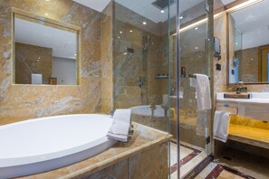 Deluxe Suite | Bathroom | Separate tub and shower, free toiletries, hair dryer, bathrobes