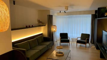 Design Apartment, 2 Bedrooms | Living area | Flat-screen TV