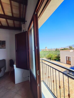 Quarto superior, vista para a lagoa | Terraço/pátio