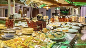 A buffet with various dishes and condiments. - ALLVITALIS Traumhotel (Karlsruhe)