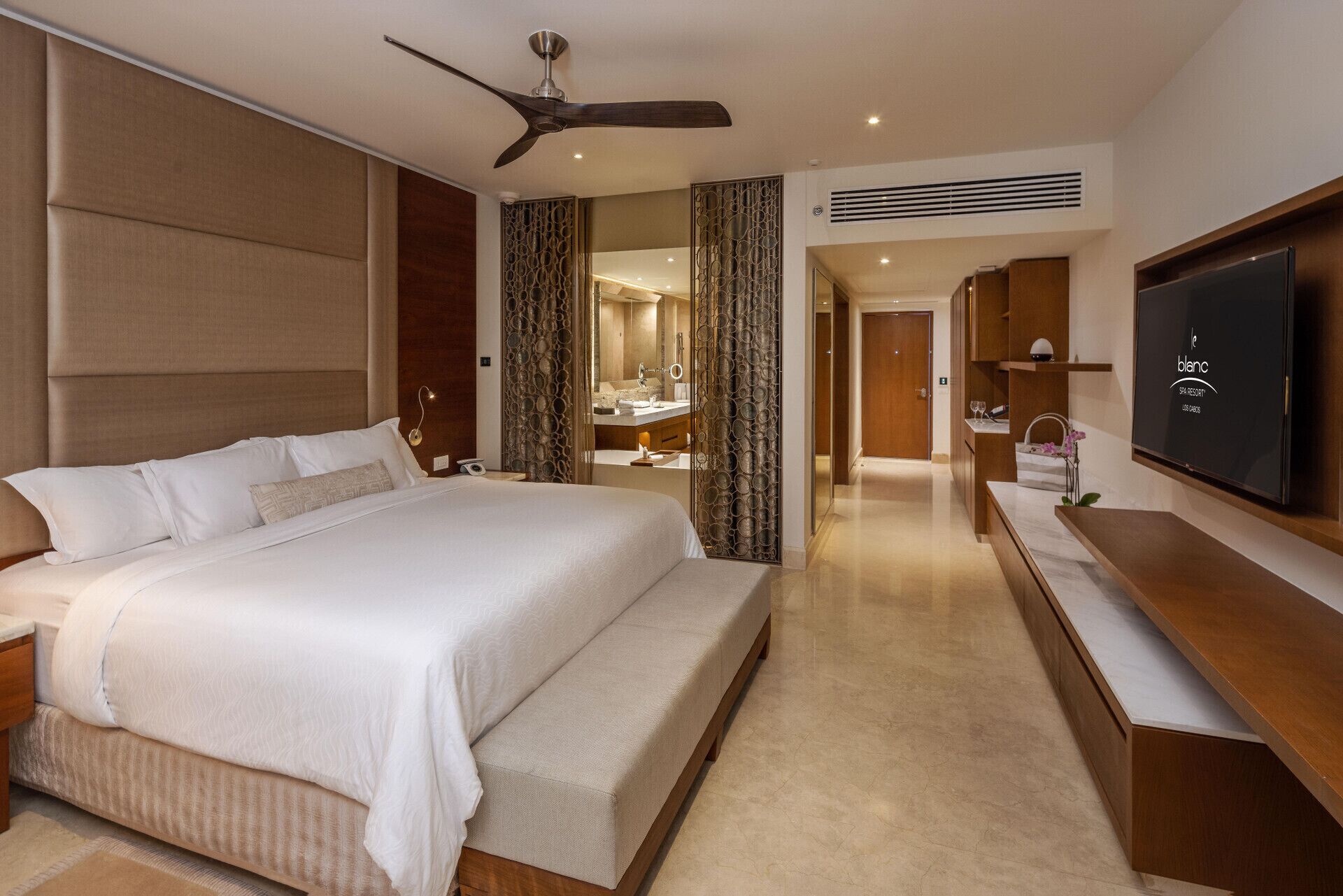 Premium bedding, down comforters, free minibar, in-room safe