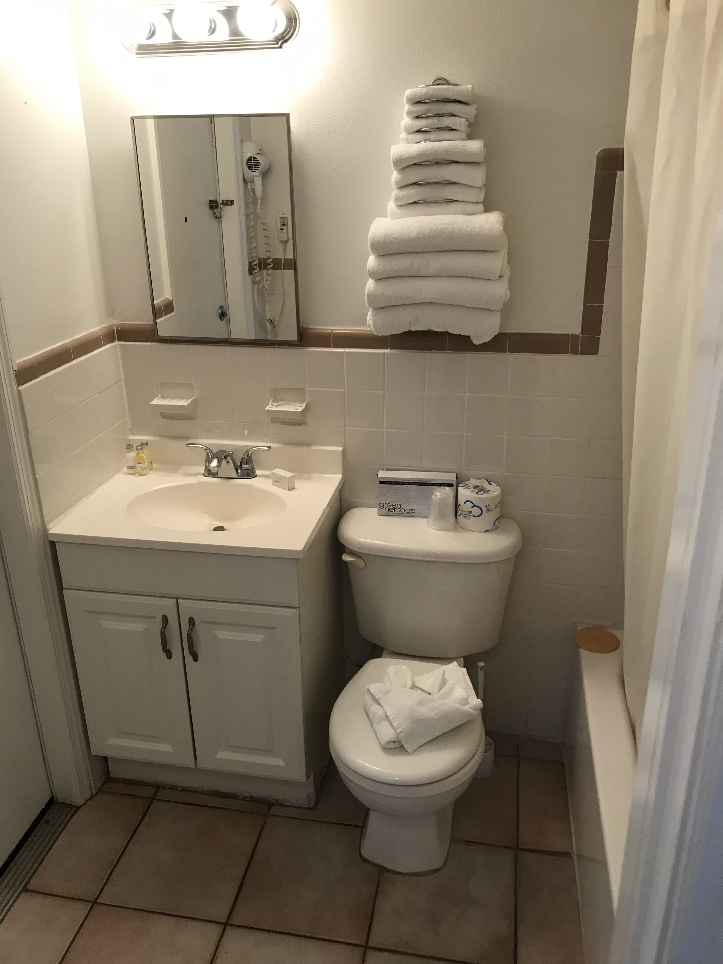 room, 1 king bed, refrigerator & microwave, courtyard view (1st floor) | bathroom | deep-soaking bathtub, free toiletries, hair dryer, towels