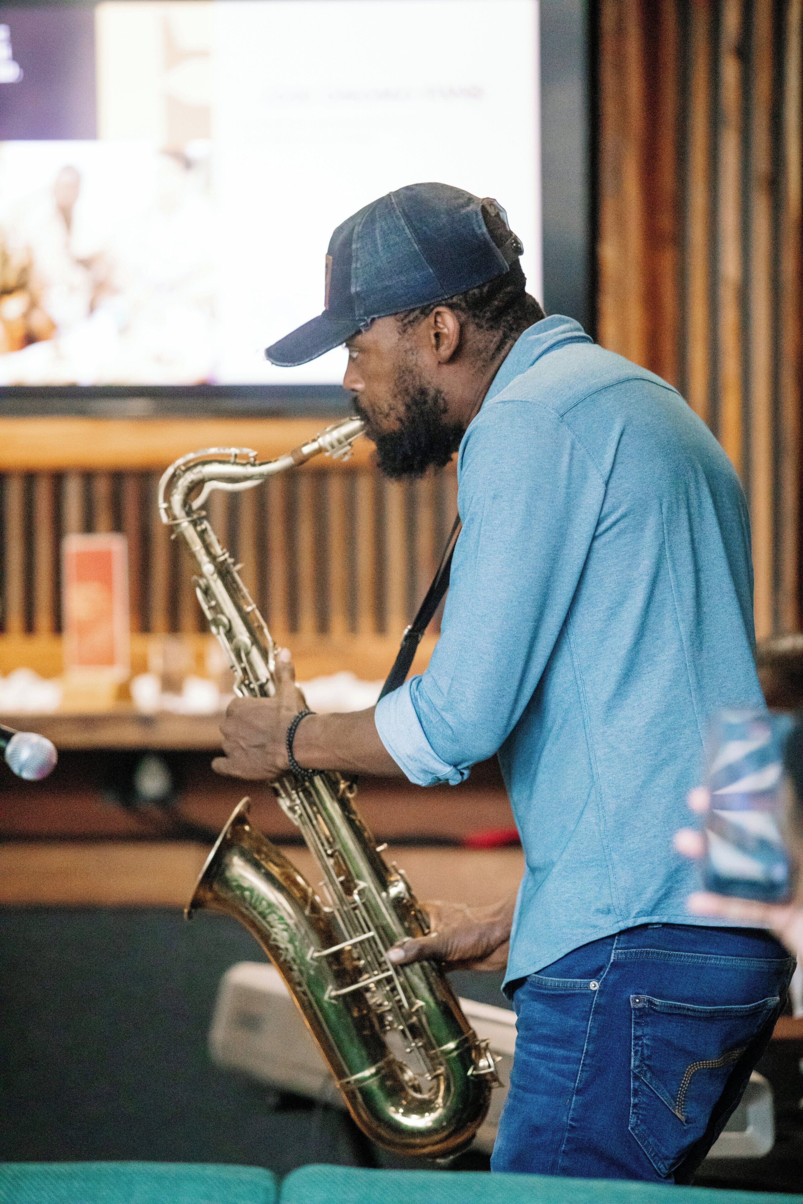 A person playing a saxophone.