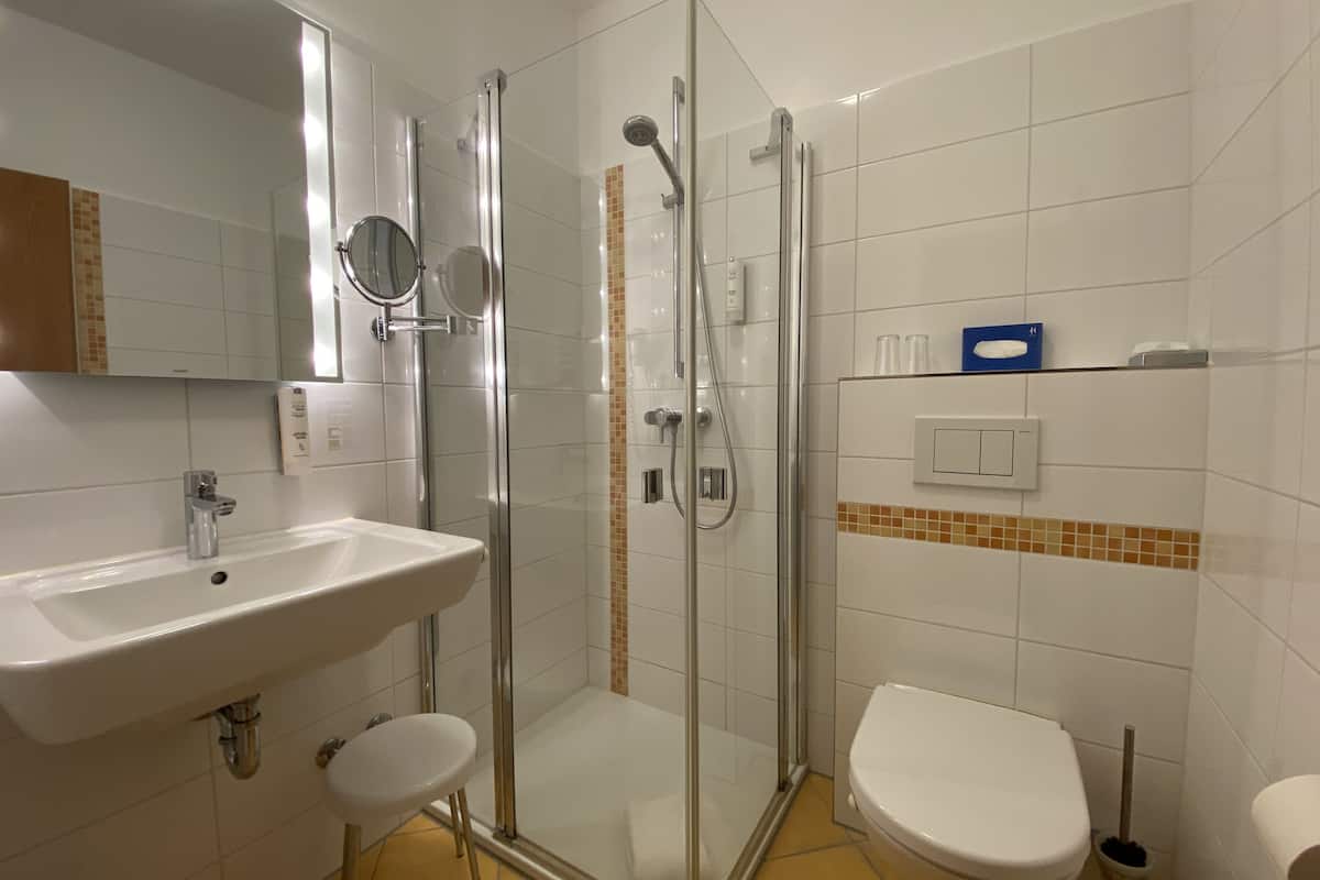 superior double room | bathroom | shower, free toiletries, hair dryer, towels