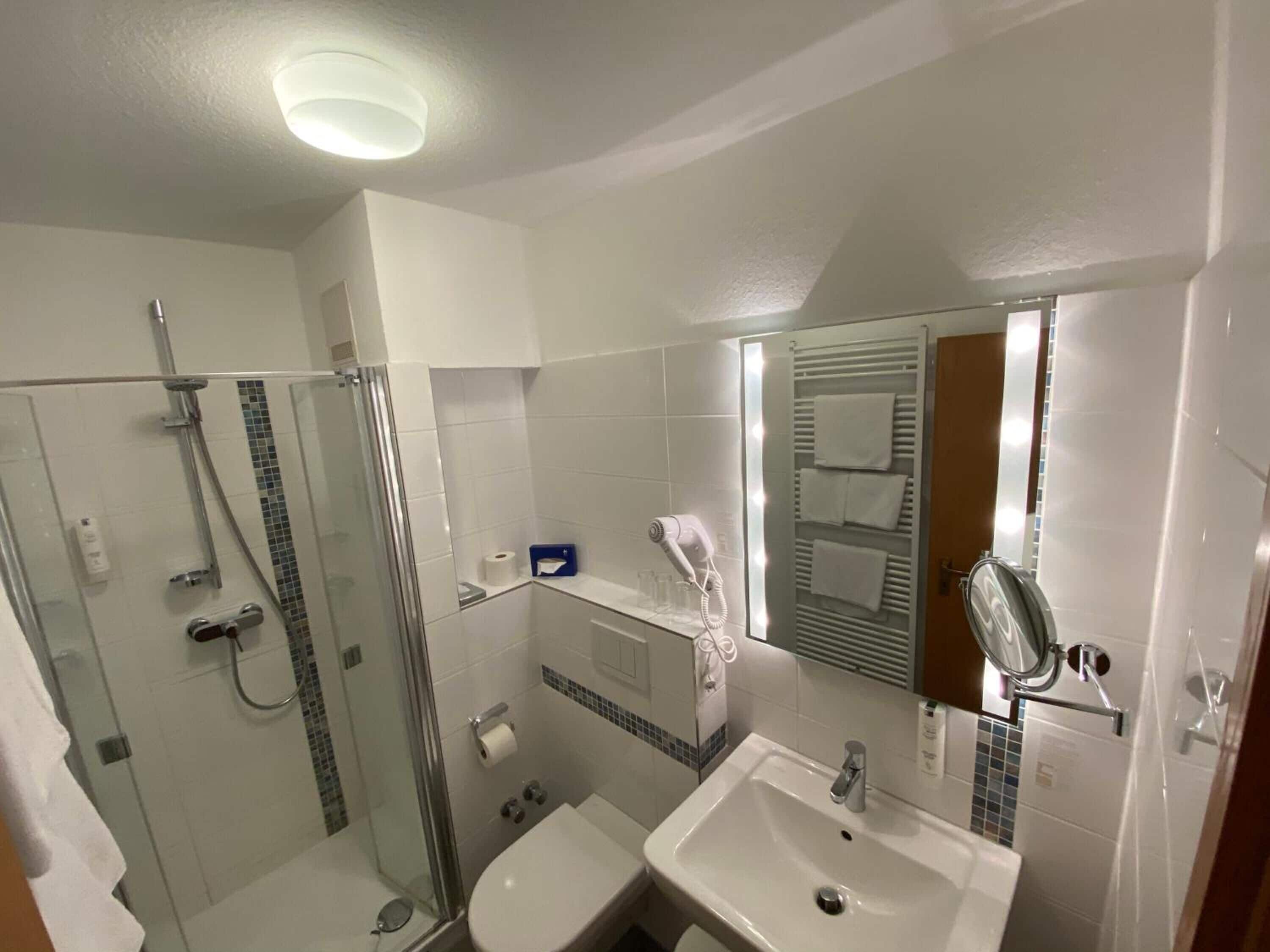 shower, free toiletries, hair dryer, towels