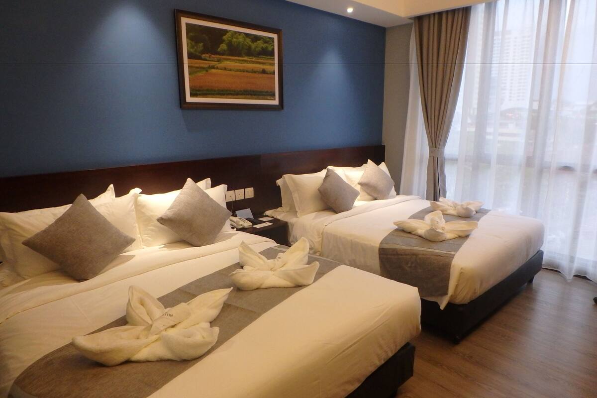 family room, 2 queen beds | minibar, in-room safe, desk, blackout curtains