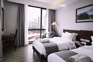 Deluxe Triple Room, City View | Minibar, in-room safe, desk, blackout drapes