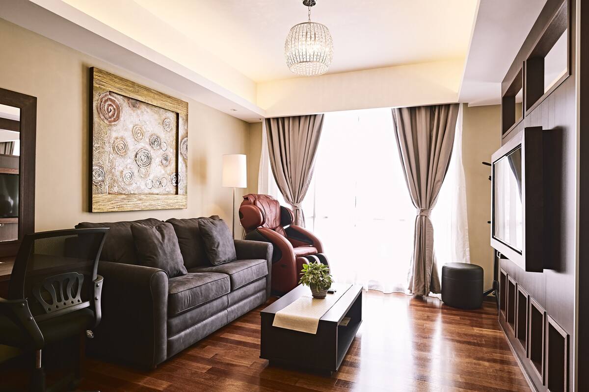 signature suite, 1 king bed, city view | minibar, in-room safe, desk, blackout curtains