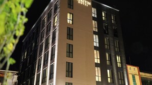 A multi-story hotel building with a sign reading 'Meritin Hotel.' - Meritin Hotel (Kuching)