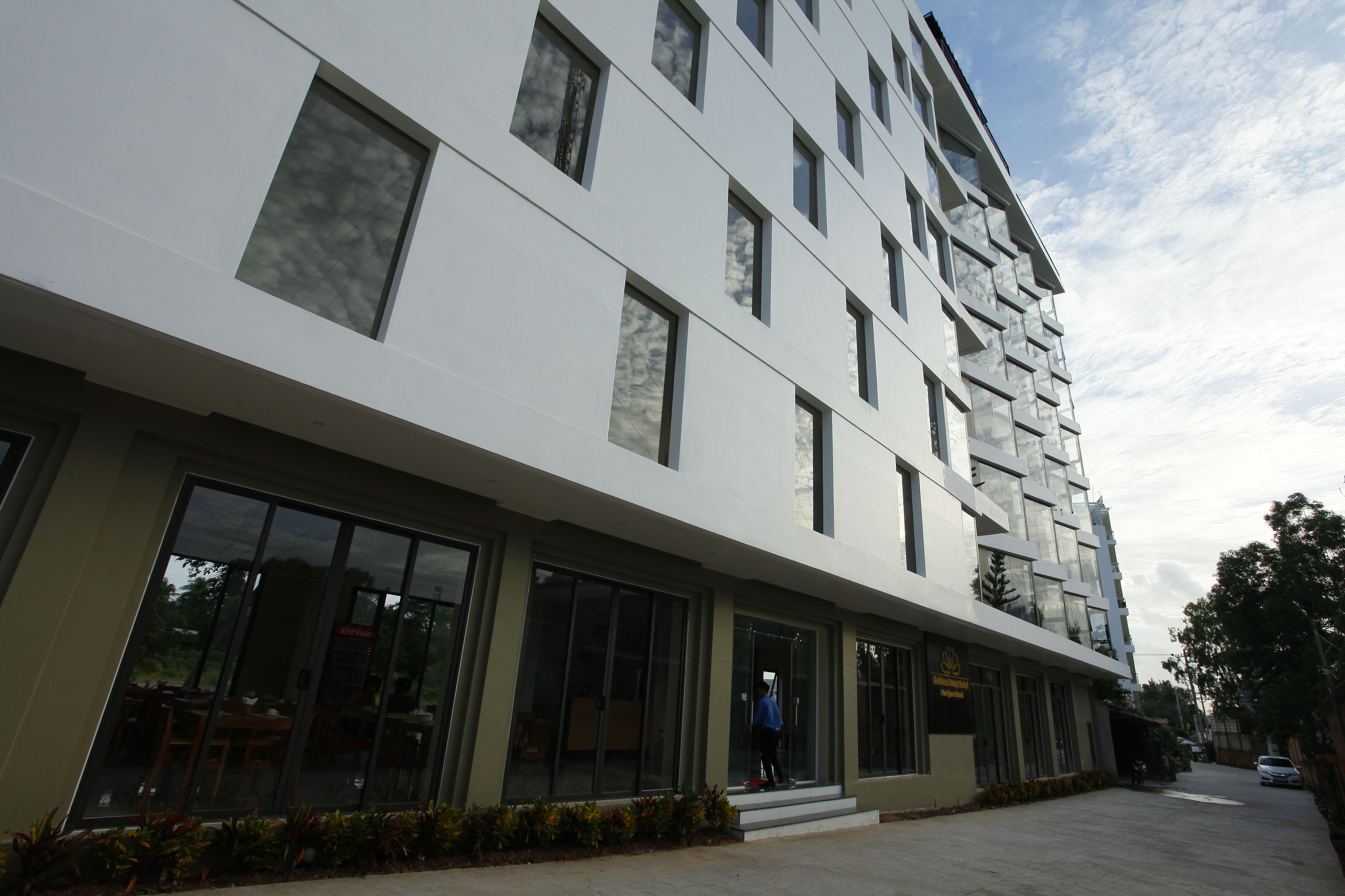 A modern building with large windows and a flat facade.