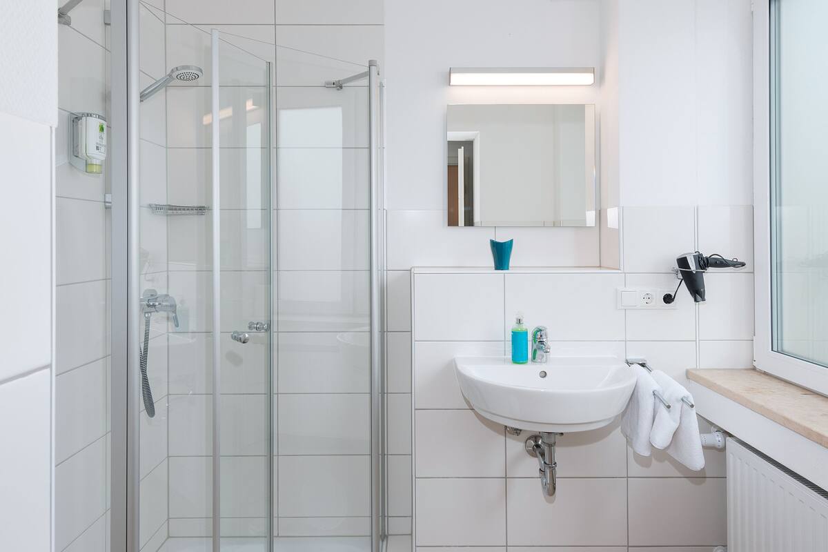 comfort double room | bathroom | shower, free toiletries, hair dryer, towels