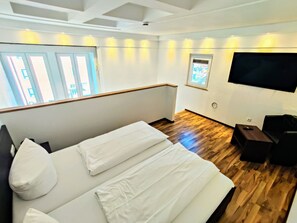 Estudio Confort | Área de sala de estar | Televisión de pantalla plana 
