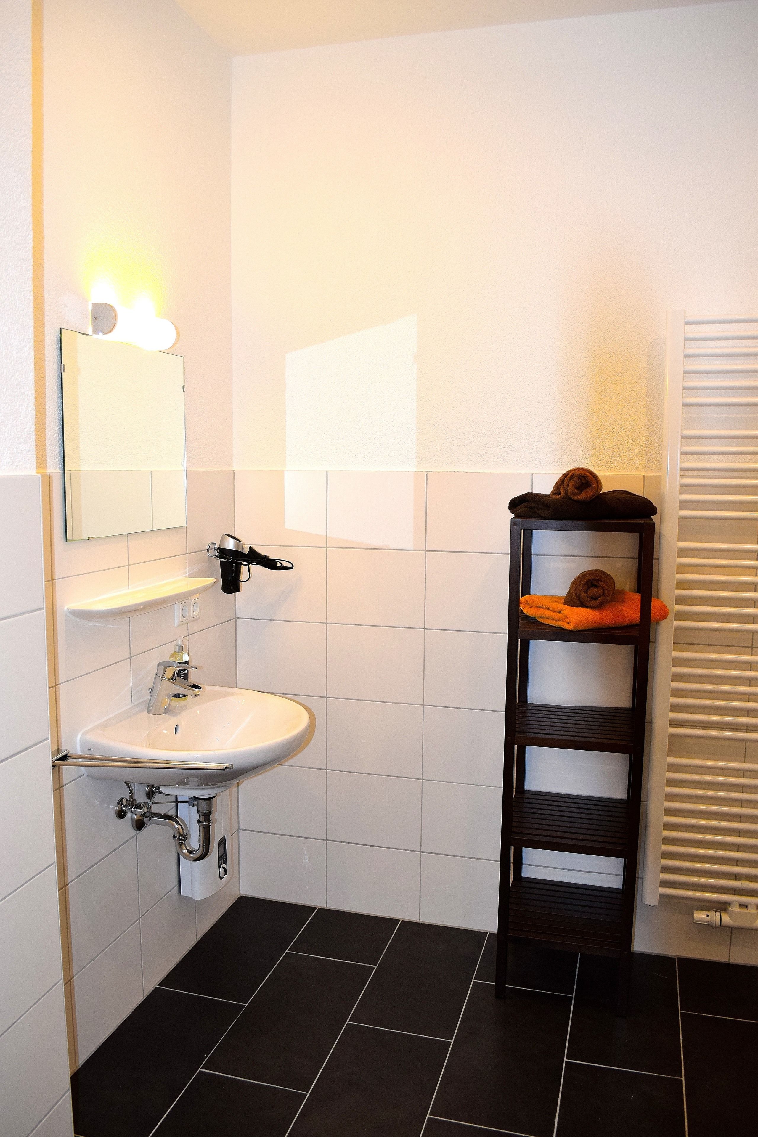 comfort studio | bathroom | shower, hair dryer, towels, soap