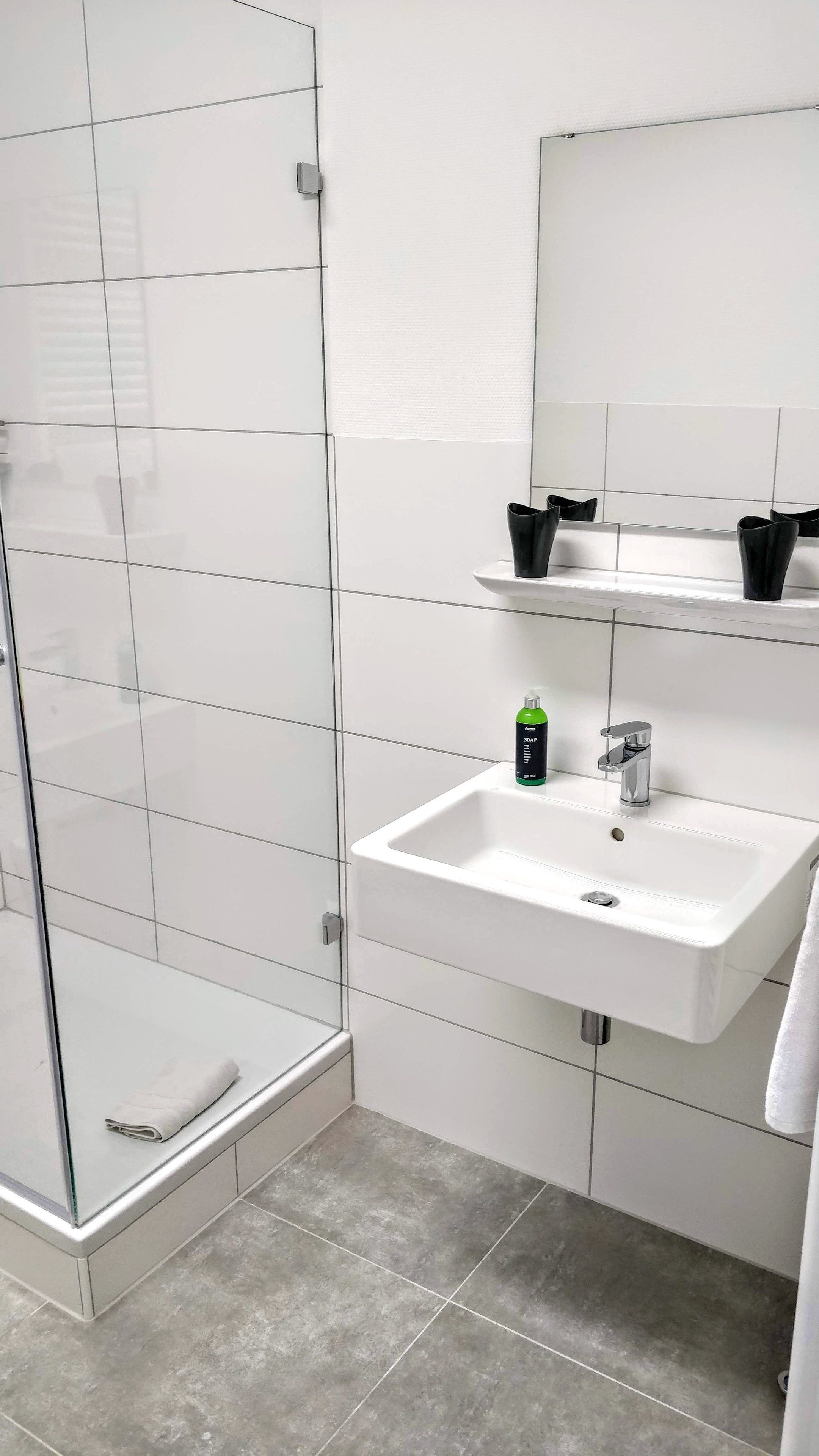 comfort studio | bathroom | shower, hair dryer, towels, soap