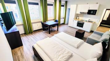 Comfort Studio | Living area | Flat-screen TV