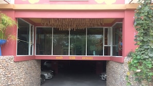 A building entrance with a sign indicating 'Entrance' and a number '2101'. - Non Nid Non Noi Design Residence (Chiang Mai)