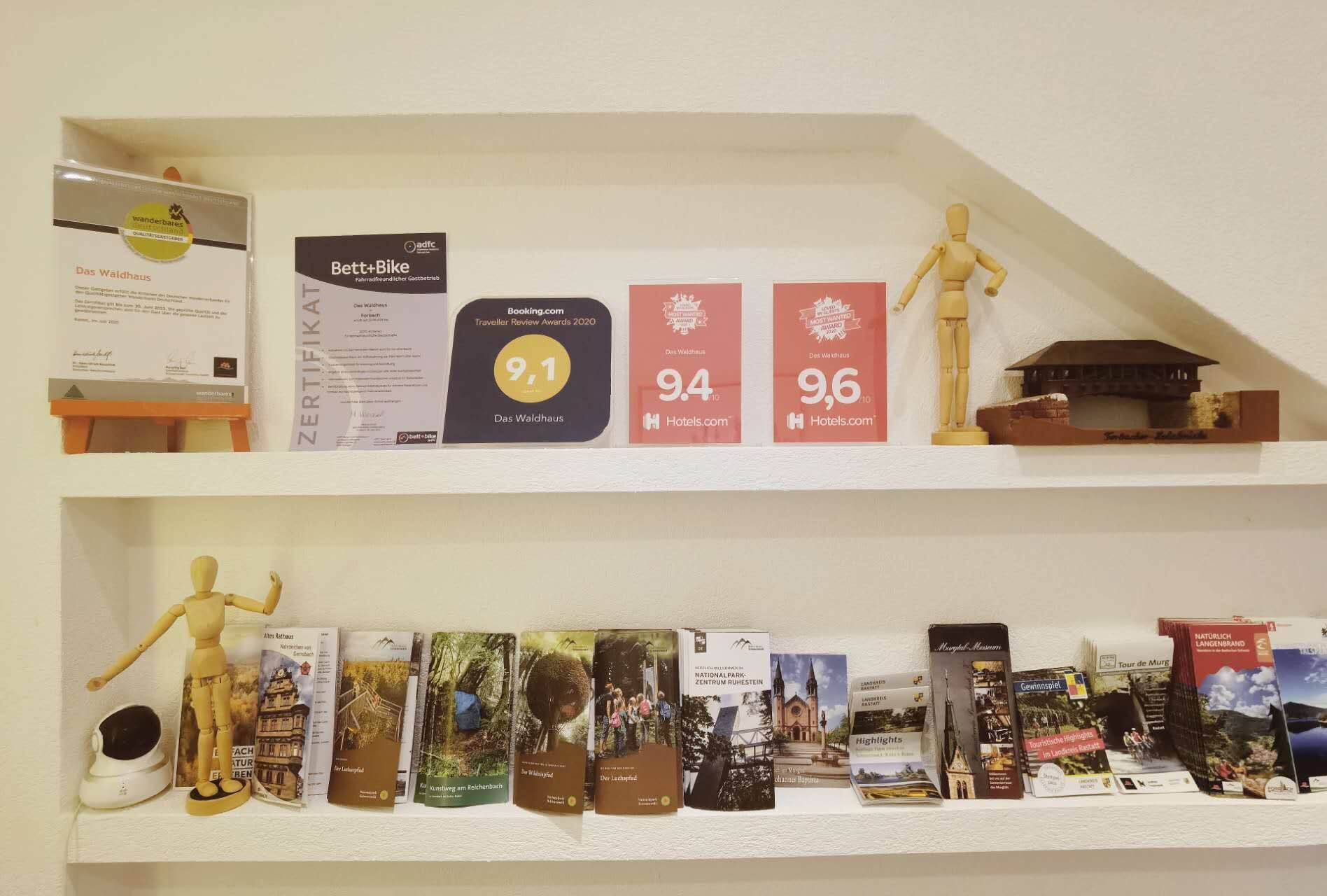 A shelf with awards and books.