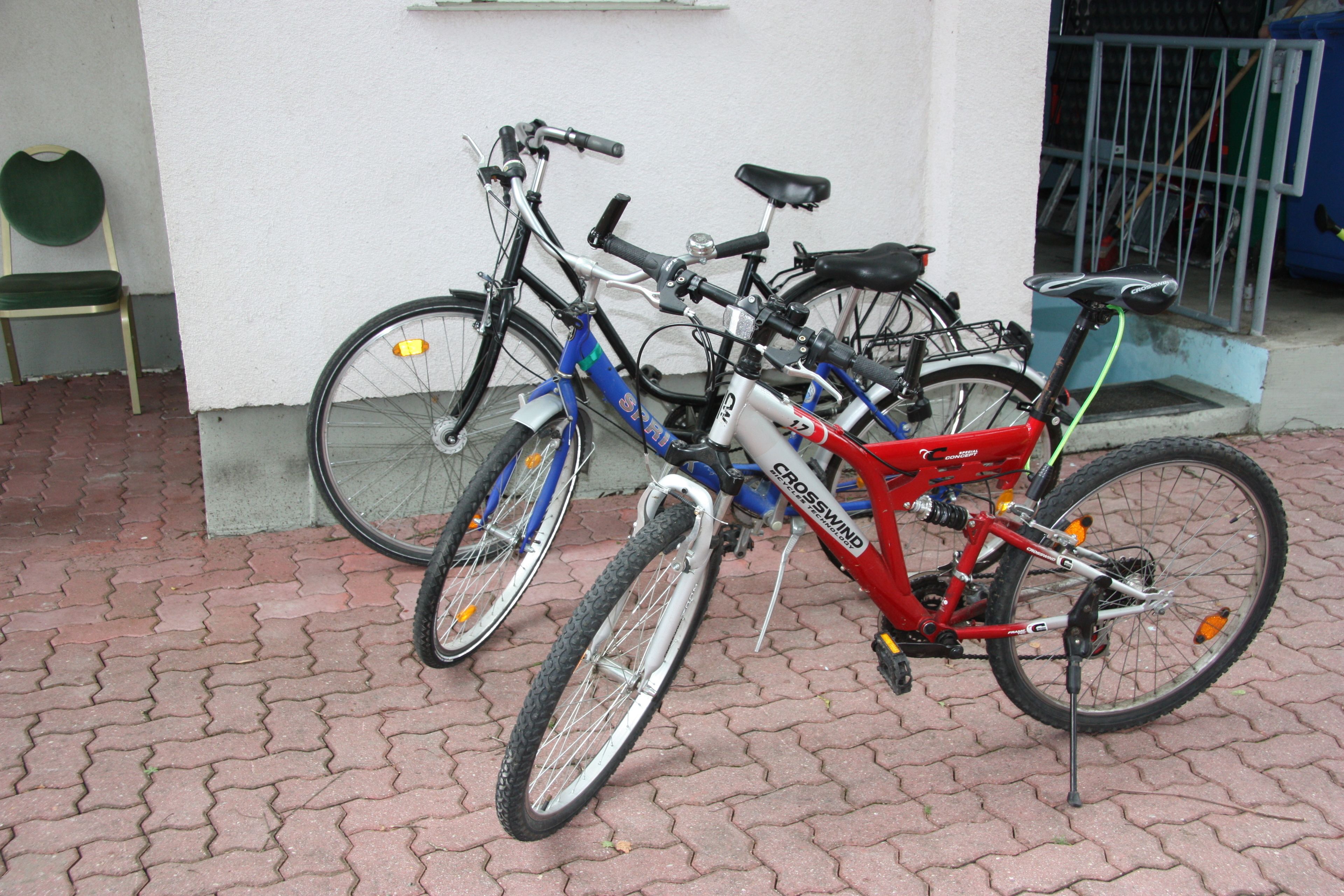 A bicycle parked on a paved surface.