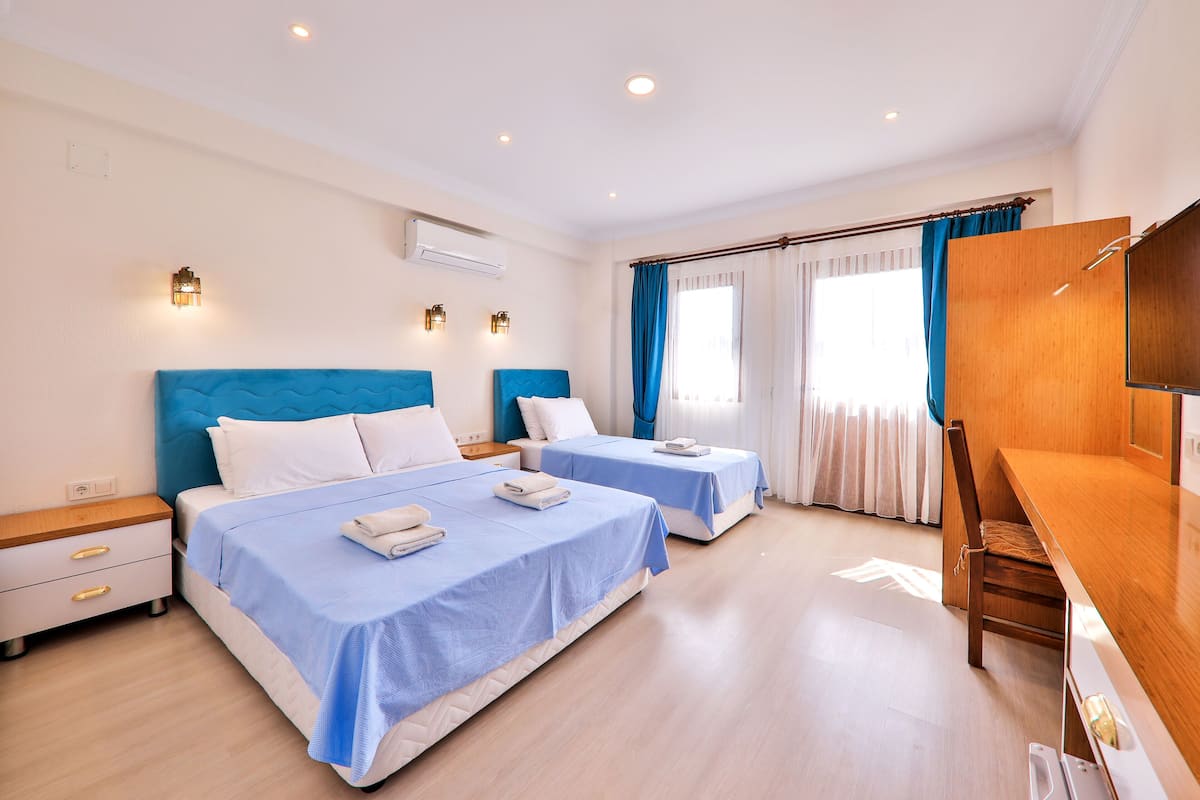 superior triple room | 1 bedroom, minibar, in-room safe, laptop workspace