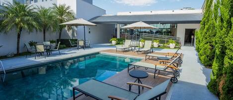 Outdoor pool, pool umbrellas, sun loungers