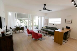 Apartment, 3 Bedrooms, Balcony, City View | Living area | TV