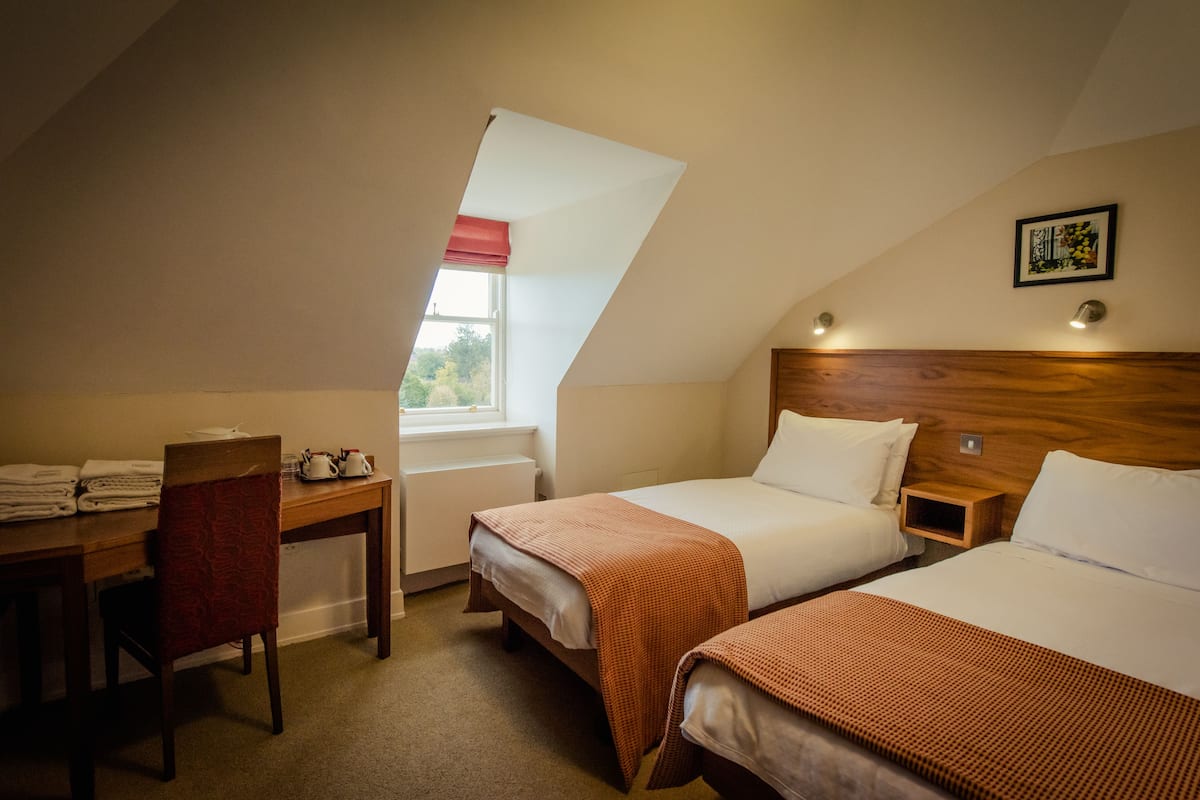 Desk, laptop workspace, free WiFi, bed sheets